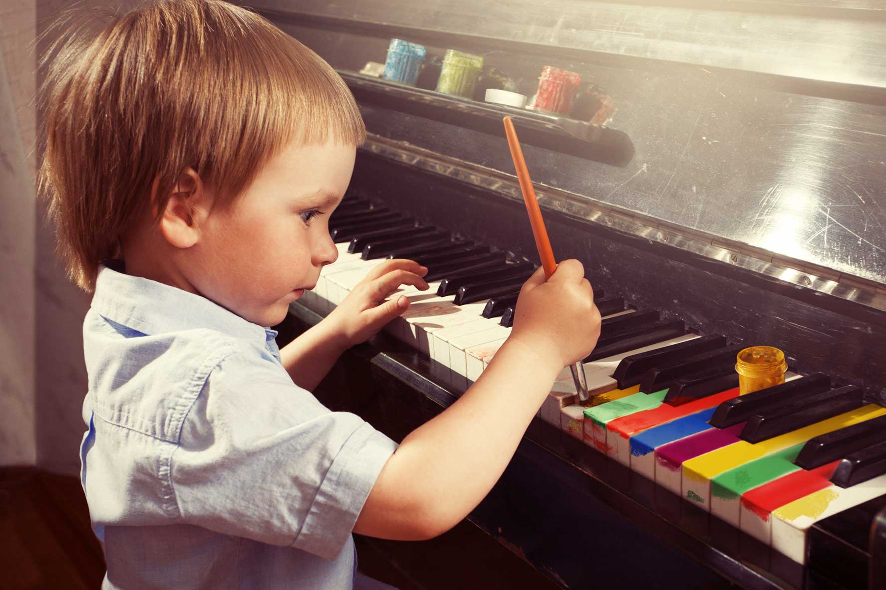 boy-painting-piano